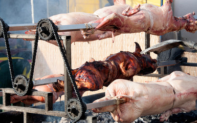Cured meat and sausages hang for sale at outdoor flea market