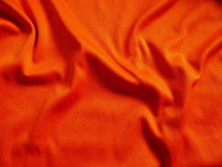 orange sportswear clothing background,silk fabric cloth