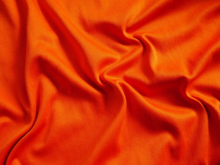 silk fabric background,texture of fabric cloth,orange sportswear clothing