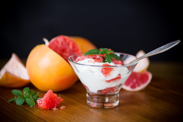 sweet homemade organic yogurt with slices of red grapefruit