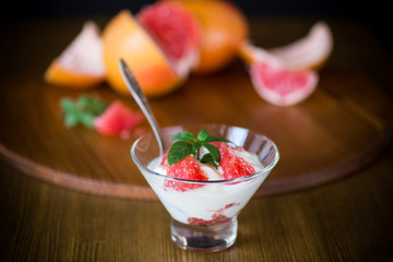 sweet homemade organic yogurt with slices of red grapefruit