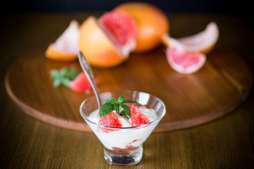 sweet homemade organic yogurt with slices of red grapefruit
