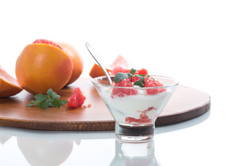 sweet homemade organic yogurt with slices of red grapefruit