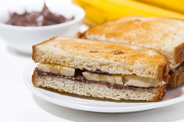 sandwich with chocolate paste and banana for breakfast, closeup