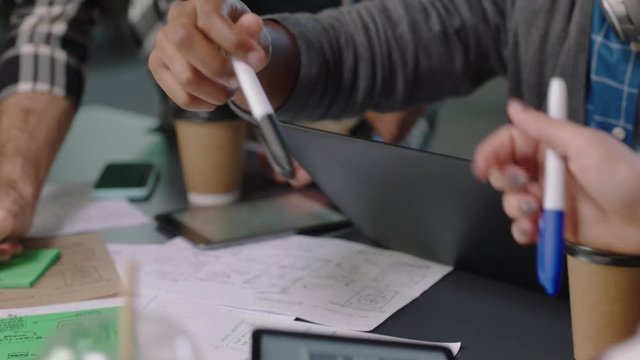 close up business people engineers developing software app web developers brainstorming solution planning design collaborating in office meeting