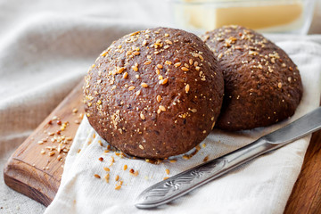 Homemade rye buns with linseeds, sesame and white poppy seeds