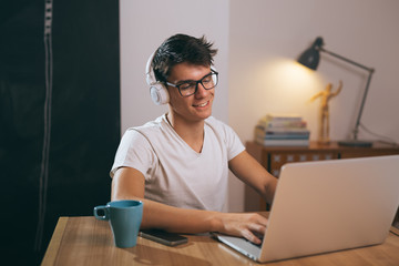 teenager taking online lessons on laptop