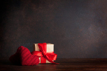 Valentines day greeting card with red heart toys and gift box