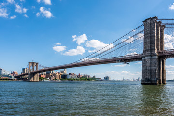 Fototapeta na wymiar The Brooklyn Bridge Crossing From Manhattan Over the East River Into Brooklyn