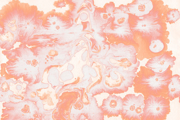 Colorful wet abstract paint leaks and splashes texture on white watercolor paper background. Natural organic shapes and design.