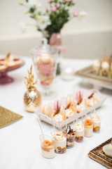 Naklejka na ściany i meble beautifully decorated table with sweet candy bar