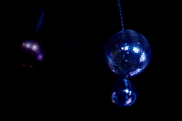 Disco ball fixed to the ceiling, night party.