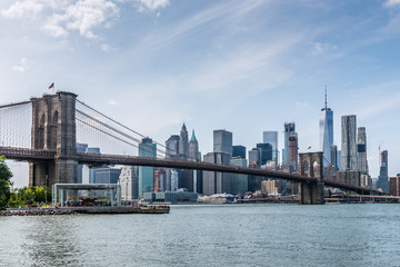 Fototapeta na wymiar New York City's Brooklyn Bridge Crossing the East River Into Manhattan