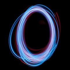 The neon number 0, blue light image, long exposure with colored fairy lights, against a black background