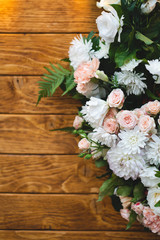 beautiful bouquets of flowers on the background of a wooden board