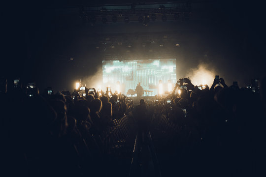 MINSK, BELARUS - 20 SEPTEMBER, 2018: Crowd at concert - retro style photo