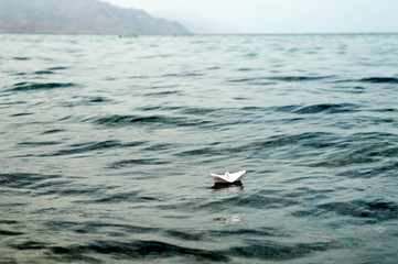 White paper ship in the sea.