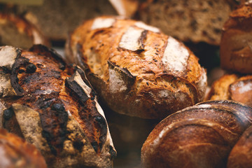 Breads on a showcase in a French bakery. Soft focus, close up view.