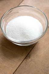 Close up on a glass dish of granulated sugar