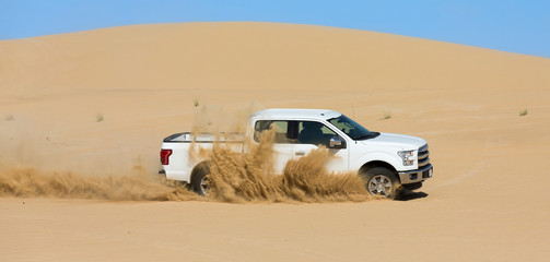 Special Utility Vehicle driving off-road on sand dune