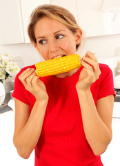 GIRL EATING SWEETCORN