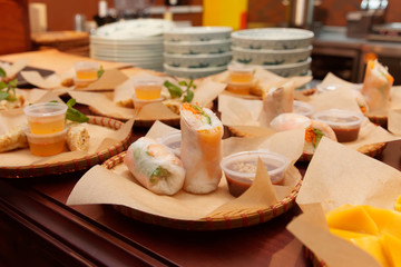 Spring rolls and other food on kitchen counter