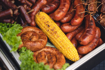 delicious grilled sausages with salad and vegetables