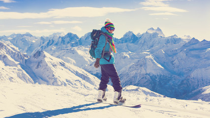Fototapeta na wymiar Woman, snowboard winter, rides, goggles, elbrus