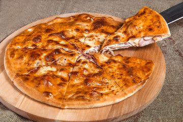stuffed closed Calzone Pizza on a natural background