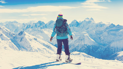 Fototapeta na wymiar Woman, snowboard winter, rides, back, elbrus