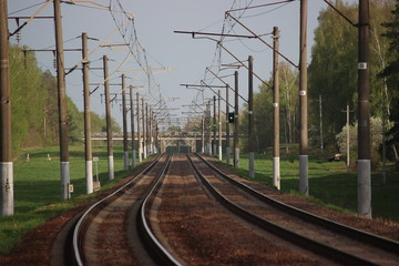 Fototapeta na wymiar Railway station with rails and electric lines for electric train