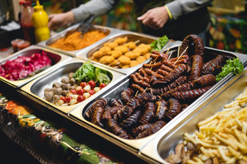 the seller sells delicious and fragrant skewers and . barbecue