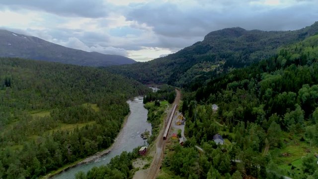 AERIAL. Train Oslo - Bergen in mountains. Norway.