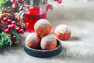 Sweet donuts from cottage cheese with powdered sugar. Christmas installation. Place for text.