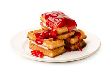 Portion of viennese waffles with sweet strawberry syrup