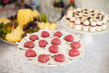 beautifully decorated table with sweet candy bar