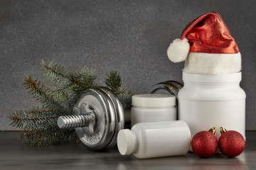 Obraz na płótnie Canvas Sports nutrition and Christmas decorations.