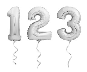 Silver numbers 1, 2, 3 made of inflatable balloons with ribbons isolated on white