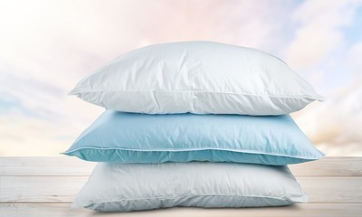 Fototapeta na wymiar Soft Pillows Pile on grey background, three pillow, sleeping