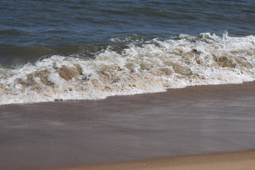Rolling waves on the beach