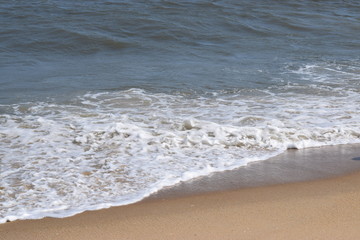 Foamy wave on the beach