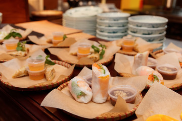 Spring rolls and another food on kitchen counter