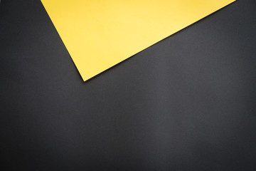 abstract paper background, black and yellow sheet of paper