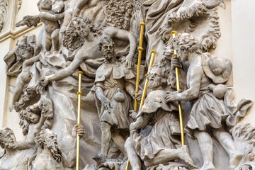 Relief sculpture on facade of the Church of Saint James The Greater with Minorite monastery in Old Town of Prague, Czech Republic, sunny day