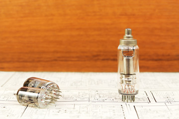 Electronic vacuum tubes on the wooden background