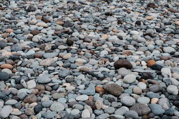 pebble stone beach - stones at ocean coast -