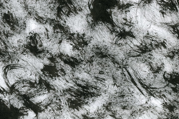 Black with grey ink texture with abstract washes and brush strokes on white watercolor paper background.