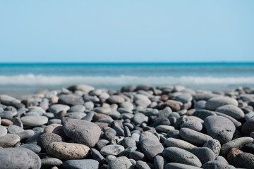 pebble stone beach - stones at ocean coast -