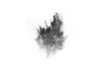 particles of charcoal on white background,abstract powder splatted on white background,Freeze motion of black powder exploding or throwing black powder.