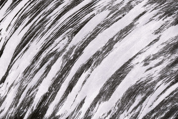 Black with grey ink texture with abstract washes and brush strokes on white watercolor paper background.